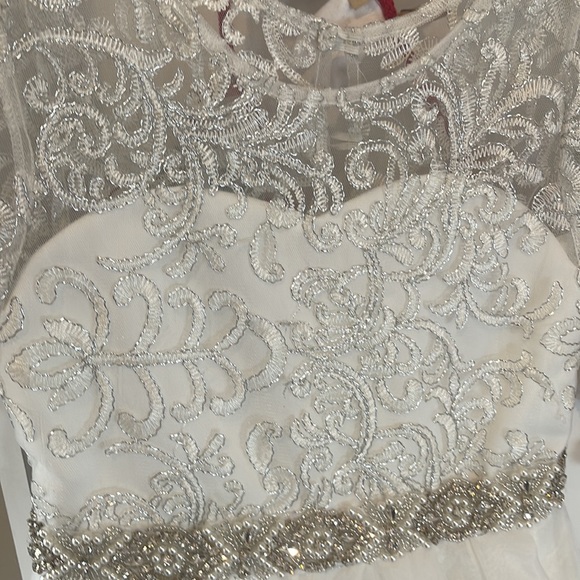 These dresses are light cream color not white but not ivory. Both for $32 - Picture 3 of 5